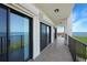 Spacious balcony with sliding glass doors and serene water views at 433 Mariner Dr # 433, Tarpon Springs, FL 34689