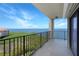 Enjoy stunning water views from this tiled balcony with black metal railings at 433 Mariner Dr # 433, Tarpon Springs, FL 34689