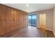 Bedroom featuring a large closet and sliding glass doors to a balcony with an ocean view at 433 Mariner Dr # 433, Tarpon Springs, FL 34689