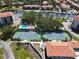 Aerial view of the community tennis courts, pool and boat docks at 433 Mariner Dr # 433, Tarpon Springs, FL 34689