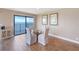 Dining area with water views from a balcony, a glass table and decorative artwork at 433 Mariner Dr # 433, Tarpon Springs, FL 34689