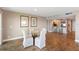 Dining area with glass table and striped chairs, with kitchen visible in background at 433 Mariner Dr # 433, Tarpon Springs, FL 34689