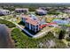Gorgeous condo building with balconies overlooking the water, with mature landscaping and tennis courts at 433 Mariner Dr # 433, Tarpon Springs, FL 34689