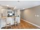 Modern kitchen with granite countertops, stainless steel appliances, and bar stool seating at 433 Mariner Dr # 433, Tarpon Springs, FL 34689