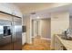 Kitchen featuring a stainless steel refrigerator and granite counters at 433 Mariner Dr # 433, Tarpon Springs, FL 34689