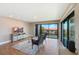 Living room with seating area, rug, and sliding doors to a balcony with a view at 433 Mariner Dr # 433, Tarpon Springs, FL 34689