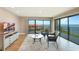 Bright living room with ocean view, comfortable seating, and modern entertainment center at 433 Mariner Dr # 433, Tarpon Springs, FL 34689