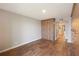 Bedroom featuring wood floors, built-in closet system, and ensuite bathroom at 433 Mariner Dr # 433, Tarpon Springs, FL 34689