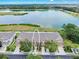 Aerial view of townhome complex with lake view at 4862 Pond Ridge Dr, Riverview, FL 33578