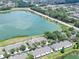 Aerial view of townhome complex and nearby lake at 4862 Pond Ridge Dr, Riverview, FL 33578