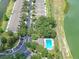 Aerial view of townhomes near community pool, parking and green space at 4862 Pond Ridge Dr, Riverview, FL 33578