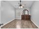The bedroom boasts hardwood floors, a ceiling fan, and a stylish wooden dresser at 4862 Pond Ridge Dr, Riverview, FL 33578