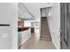Inviting entryway with tiled floors and staircase, offering seamless access to the kitchen and living areas at 4862 Pond Ridge Dr, Riverview, FL 33578