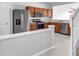Well-equipped kitchen featuring stainless steel appliances, wood cabinetry, and a functional layout at 4862 Pond Ridge Dr, Riverview, FL 33578