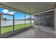 The screened patio offers a bright view of the fenced-in yard at 4862 Pond Ridge Dr, Riverview, FL 33578