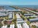 Aerial view of waterfront community showcasing a marina, bridge, and coastline at 4910 W Mcelroy Ave # 6, Tampa, FL 33611