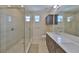 Modern bathroom with a glass-enclosed shower and double sink vanity at 4910 W Mcelroy Ave # 6, Tampa, FL 33611