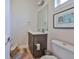Powder room with a modern vanity, sink, toilet, and stylish decor at 4910 W Mcelroy Ave # 6, Tampa, FL 33611