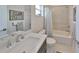 Modern bathroom with a stylish vanity, updated fixtures, and a shower-tub combination at 4910 W Mcelroy Ave # 6, Tampa, FL 33611