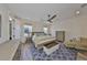 Inviting bedroom with a comfortable bed, blue rug, and neutral furniture at 4910 W Mcelroy Ave # 6, Tampa, FL 33611