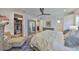 Spacious bedroom with a bed, chair, walk-in closet and en-suite bathroom at 4910 W Mcelroy Ave # 6, Tampa, FL 33611