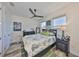Bright bedroom featuring a comfortable bed, ceiling fan, and stylish decor at 4910 W Mcelroy Ave # 6, Tampa, FL 33611