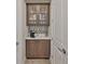 Charming butler's pantry with upper glass-front cabinets, coffee maker, and a clean counter at 4910 W Mcelroy Ave # 6, Tampa, FL 33611