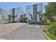 Modern townhome with hardscape driveway and decorative stone accents at 4910 W Mcelroy Ave # 6, Tampa, FL 33611