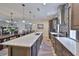 Modern kitchen with stainless steel appliances, marble counter tops, kitchen island and hardwood floors at 4910 W Mcelroy Ave # 6, Tampa, FL 33611