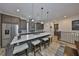 Gourmet kitchen with white countertops, stainless steel appliances, and stylish island seating at 4910 W Mcelroy Ave # 6, Tampa, FL 33611