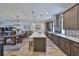 Open kitchen with stainless appliances, marble countertops, pendant lighting and eat in kitchen table at 4910 W Mcelroy Ave # 6, Tampa, FL 33611