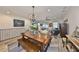 View of the living room and dining room with hardwood floors and views of the backyard at 4910 W Mcelroy Ave # 6, Tampa, FL 33611