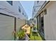 Outdoor patio with a cozy seating arrangement, artificial turf, and privacy fencing at 4910 W Mcelroy Ave # 6, Tampa, FL 33611