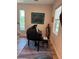 Elegant piano room featuring a glossy black piano with art and natural light from the windows at 4910 W Mcelroy Ave # 6, Tampa, FL 33611