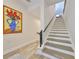 Elegant staircase featuring hardwood steps and a modern railing design at 4910 W Mcelroy Ave # 6, Tampa, FL 33611