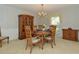 Dining room features a chandelier, furniture and a hutch, perfect for Gathering gatherings at 534 Richards Ct, Clearwater, FL 33755
