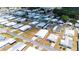Overhead shot of manufactured home in a 55+ community featuring a well-maintained lawn and beautiful landscaping at 5646 Cheyenne St, Zephyrhills, FL 33542