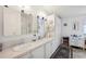 Bright bathroom with double sinks, ample cabinet space, and well-lit mirrors, offering a clean and functional design at 5646 Cheyenne St, Zephyrhills, FL 33542