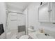 Clean bathroom with a shower, toilet, sink, and vanity mirror at 5646 Cheyenne St, Zephyrhills, FL 33542