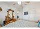 Bedroom featuring bed, dressers, a mirror and access to another room at 5646 Cheyenne St, Zephyrhills, FL 33542