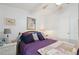 Comfortable bedroom featuring a bed, side tables with lamps, and artwork at 5646 Cheyenne St, Zephyrhills, FL 33542