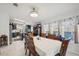 Open-concept, bright dining room and kitchen features marble floors and coordinated blue accents at 5646 Cheyenne St, Zephyrhills, FL 33542