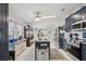Kitchen with island, blue cabinets, granite countertops and stainless steel appliances at 5646 Cheyenne St, Zephyrhills, FL 33542