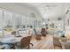 Bright, sunny sunroom with vaulted ceilings, plenty of windows and furniture for seating at 5646 Cheyenne St, Zephyrhills, FL 33542