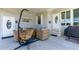 Relaxing porch featuring comfortable seating and a charming hanging swing, perfect for outdoor enjoyment at 5646 Cheyenne St, Zephyrhills, FL 33542