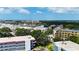 Aerial view of apartment complex surrounded by trees, parking, and other buildings at 5660 80Th N St # C101, St Petersburg, FL 33709