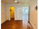Bedroom with wood-look floors, closet, and an open doorway at 5660 80Th N St # C101, St Petersburg, FL 33709