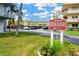 Berkshire B & C sign with colorful landscaping, convenient covered parking, and attractive midrise building at 5660 80Th N St # C101, St Petersburg, FL 33709