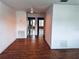 Inviting open-concept living space featuring wood-look flooring and views into the kitchen at 5660 80Th N St # C101, St Petersburg, FL 33709