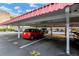 Carport area with assigned parking spaces and shade from the sun and elements at 5660 80Th N St # C101, St Petersburg, FL 33709